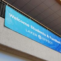 Welcome Students and Families vinyl banner hanging from the Kirkhof balcony